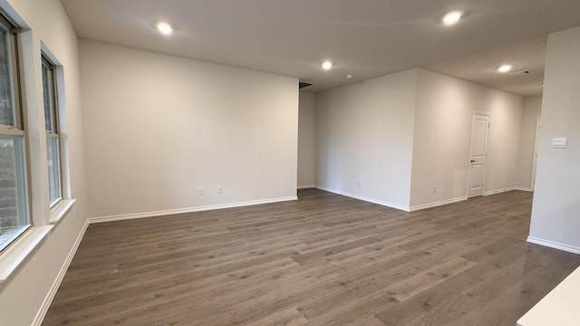 spare room featuring dark hardwood / wood-style flooring