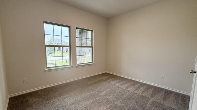 carpeted empty room with a mountain view