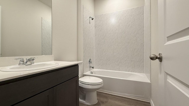 full bathroom featuring vanity, hardwood / wood-style floors,  shower combination, and toilet