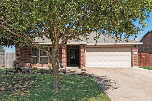 ranch-style house with a garage and a front lawn