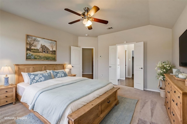 carpeted bedroom featuring ceiling fan and vaulted ceiling