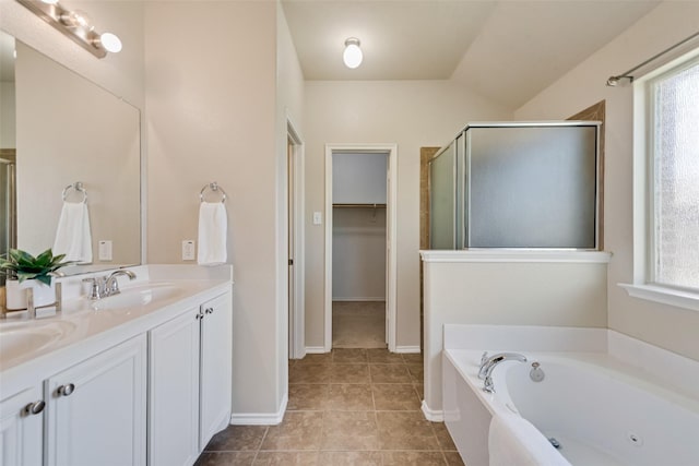 bathroom with vanity, separate shower and tub, and tile patterned floors