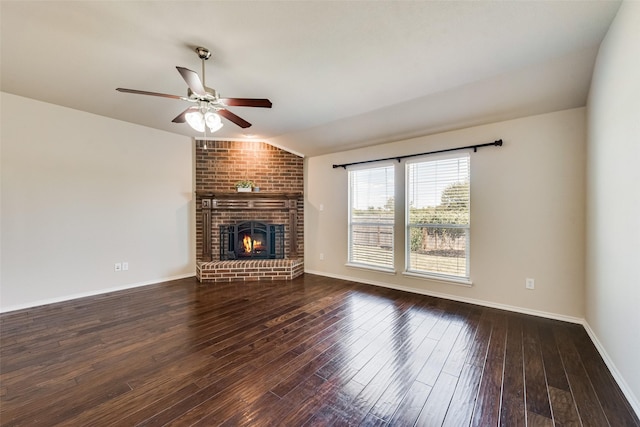 unfurnished living room with ceiling fan, a fireplace, dark wood-type flooring, and lofted ceiling