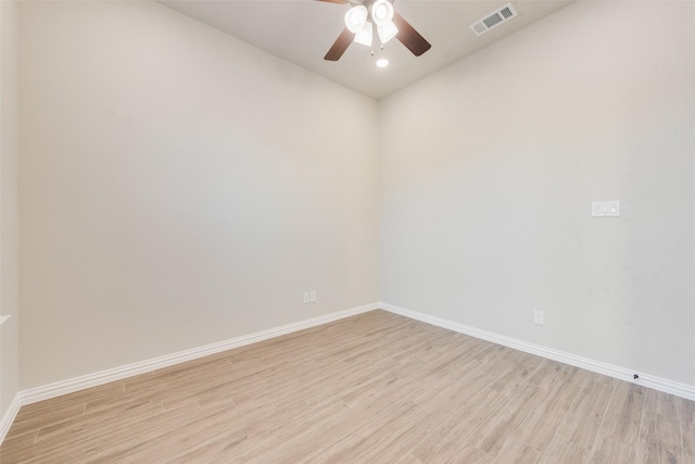 spare room with ceiling fan and light hardwood / wood-style flooring