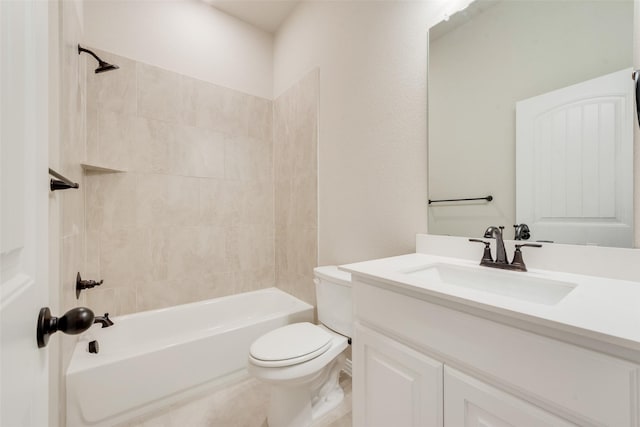 full bathroom with toilet, vanity, and tiled shower / bath