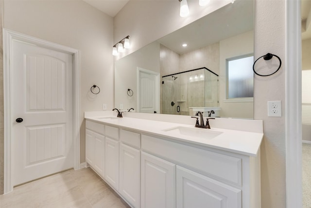 bathroom featuring vanity and an enclosed shower