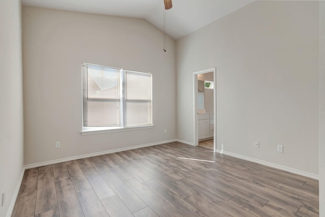 unfurnished room with light wood-type flooring, high vaulted ceiling, and ceiling fan