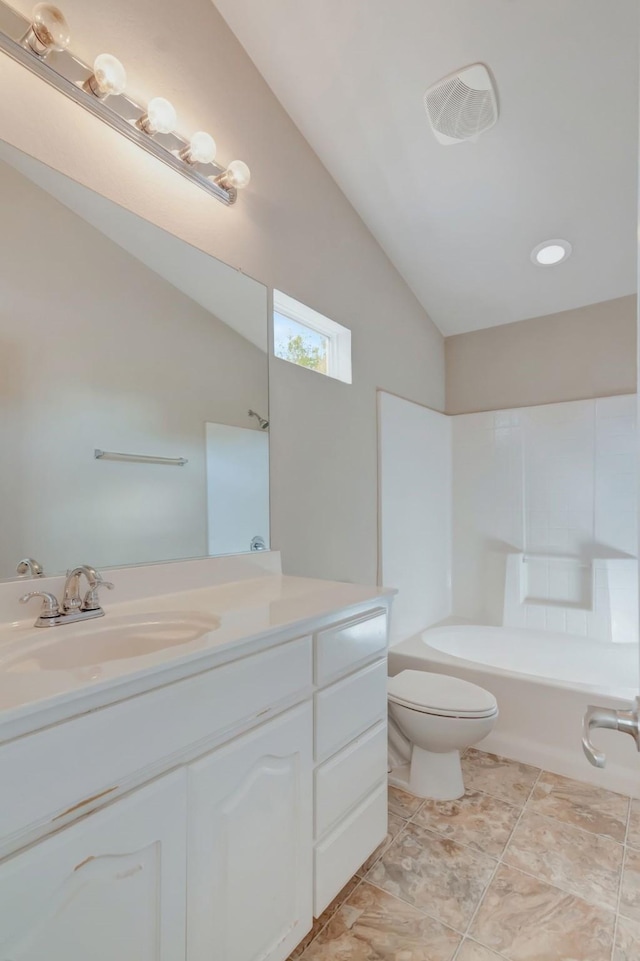 full bathroom featuring vanity, tub / shower combination, vaulted ceiling, and toilet