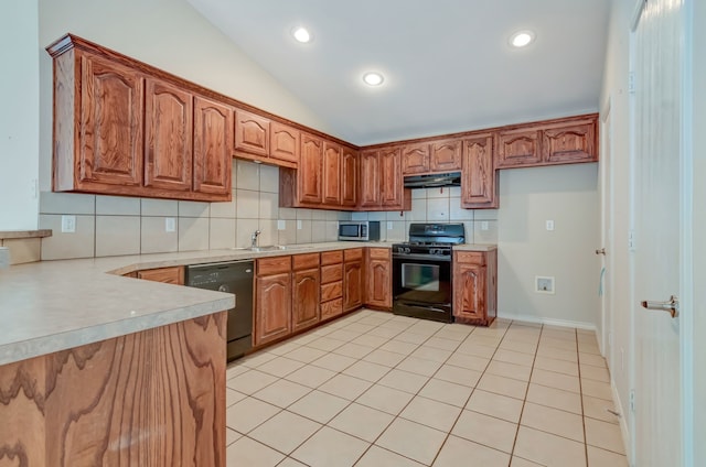 kitchen with sink, lofted ceiling, decorative backsplash, light tile patterned flooring, and black appliances