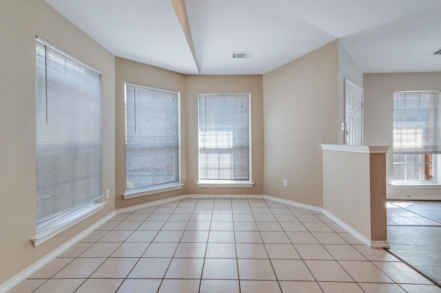 unfurnished dining area featuring light tile patterned floors