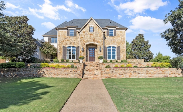 7005 Shinnecock Hills Dr, Fort Worth, TX 76132 - french country home with a front lawn and stone siding