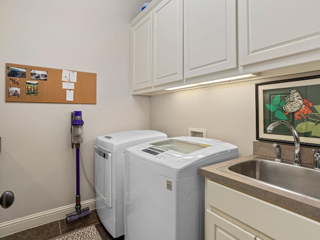 7005 Shinnecock Hills Dr, Fort Worth, TX 76132 - laundry area featuring baseboards, cabinet space, a sink, and separate washer and dryer