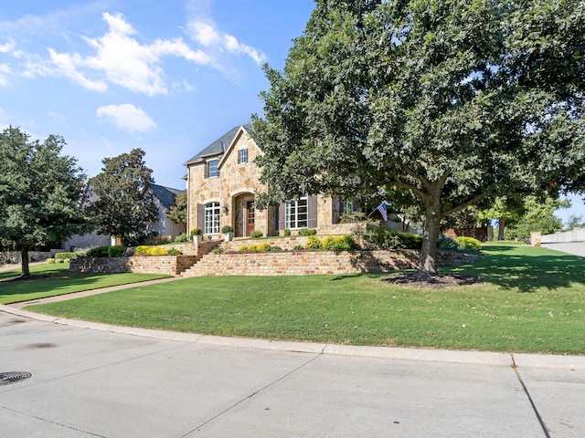 7005 Shinnecock Hills Dr, Fort Worth, TX 76132 - view of front of house featuring stone siding and a front yard