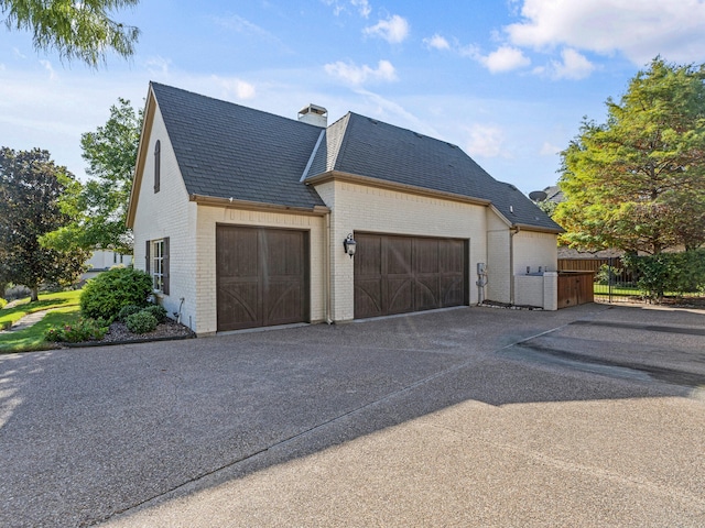 view of property exterior featuring a garage