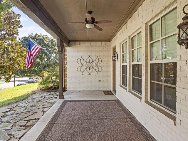 view of patio featuring ceiling fan