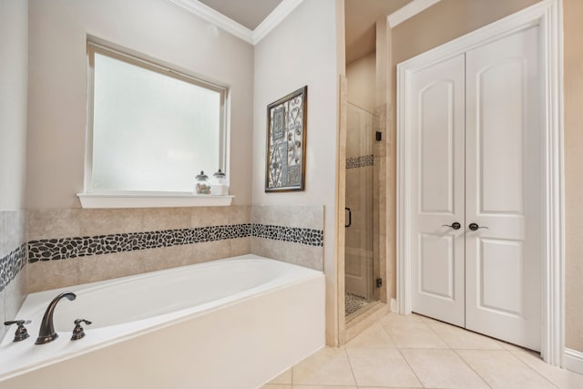 bathroom featuring plus walk in shower, crown molding, and tile patterned flooring