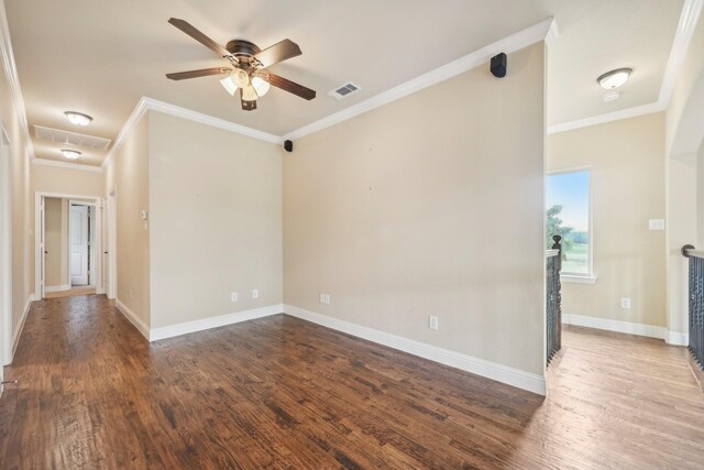 unfurnished room with ornamental molding, ceiling fan, and dark hardwood / wood-style floors