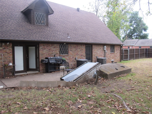 rear view of property featuring french doors