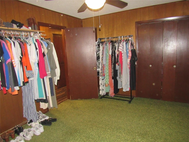 interior space featuring carpet floors and ceiling fan