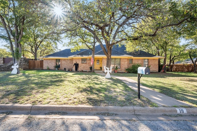 ranch-style home with a front yard