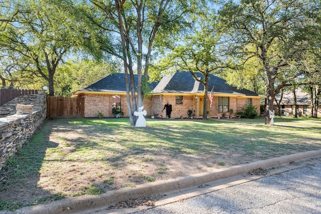 ranch-style house with a front yard