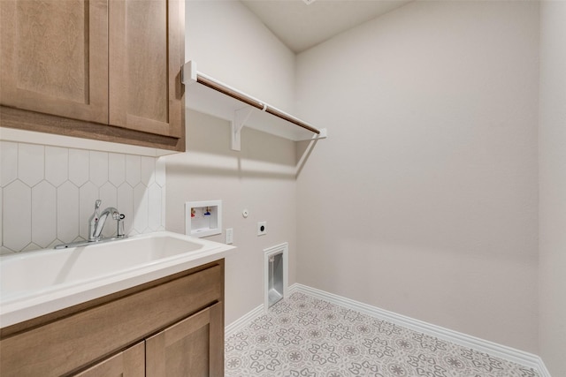 laundry area with cabinets, washer hookup, sink, and electric dryer hookup