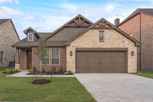 view of front of house featuring central AC, a garage, and a front yard