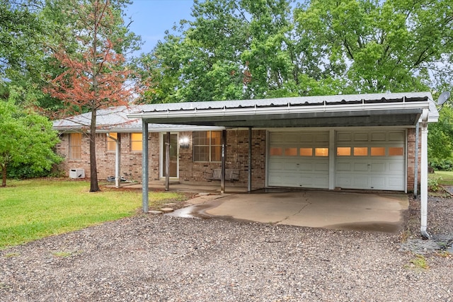 view of front of property with a front lawn and a garage