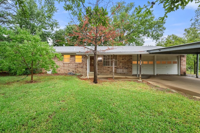 ranch-style house featuring a front yard and a garage