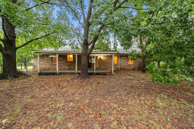 back of property with a patio