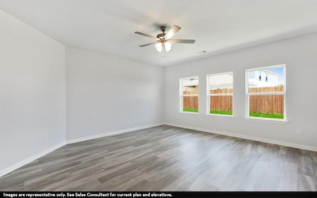 unfurnished room with ceiling fan and wood-type flooring