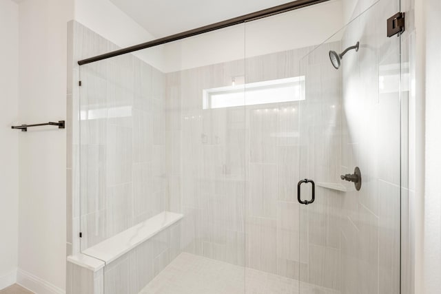 bathroom featuring an enclosed shower