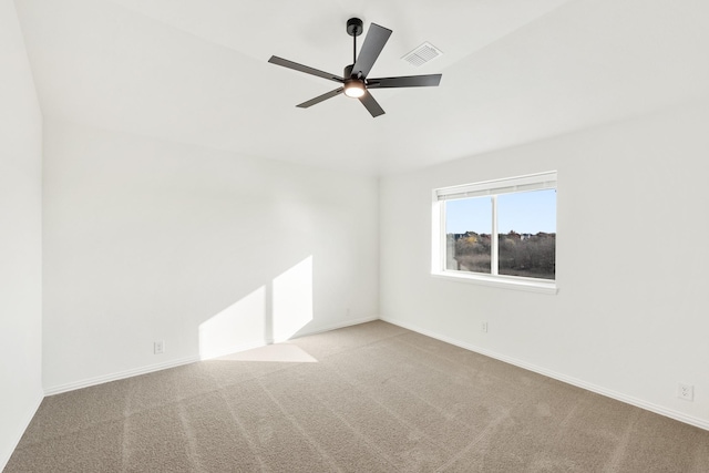 carpeted empty room featuring ceiling fan