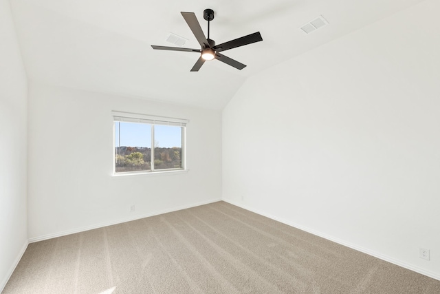 empty room featuring carpet flooring, ceiling fan, and lofted ceiling