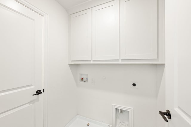 clothes washing area featuring cabinets, washer hookup, gas dryer hookup, and electric dryer hookup