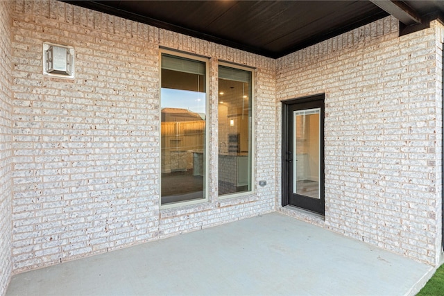 entrance to property with a patio area