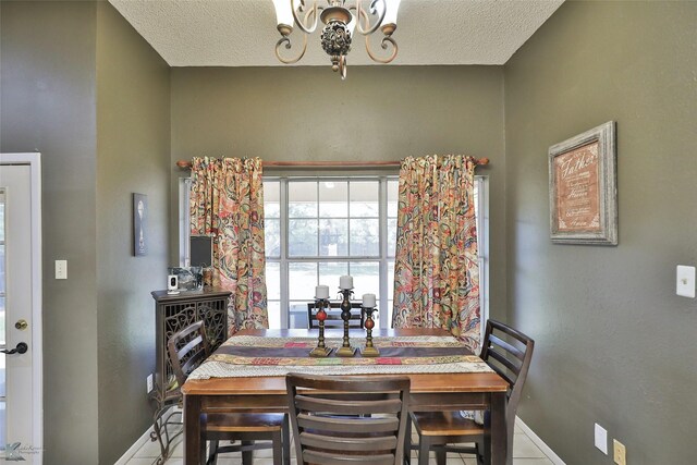 kitchen featuring white appliances, sink, light stone countertops, a notable chandelier, and kitchen peninsula