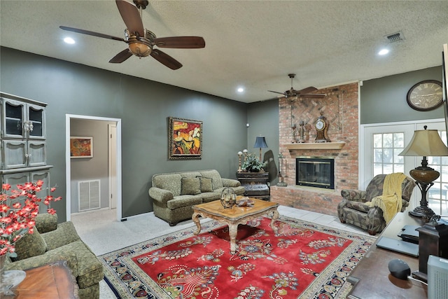 living room featuring a fireplace and a textured ceiling