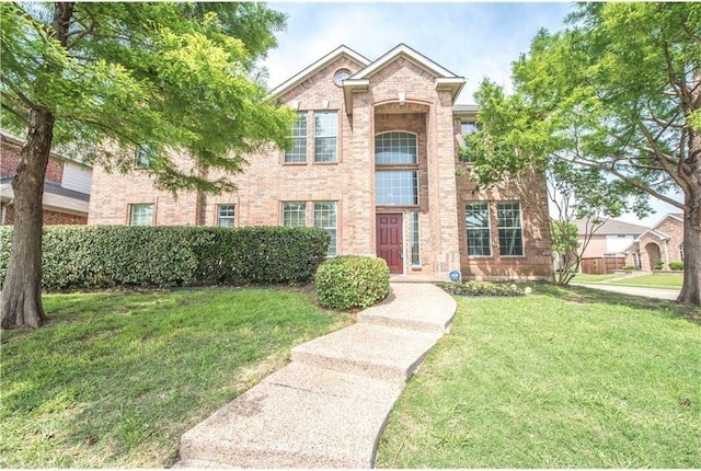 6321 Bear Run Rd, The Colony, TX 75056 - traditional home featuring brick siding and a front lawn