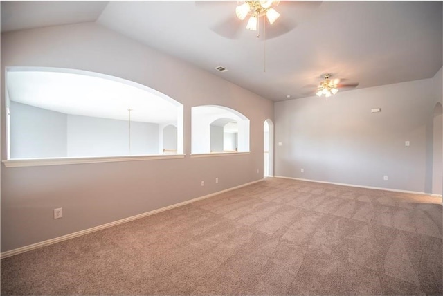 unfurnished room with ceiling fan, carpet floors, and vaulted ceiling