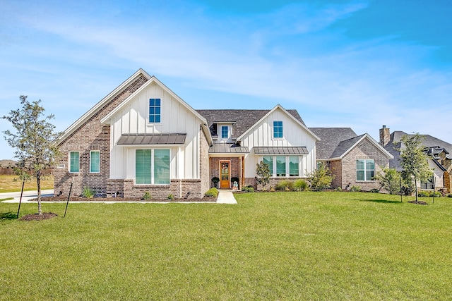 view of front of house with metal roof, a standing seam roof, a front lawn, and board and batten siding
