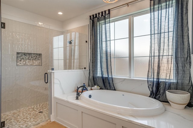 full bathroom featuring recessed lighting, a stall shower, and a garden tub