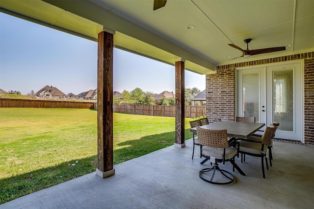 view of patio / terrace featuring a fenced backyard, a ceiling fan, and outdoor dining area