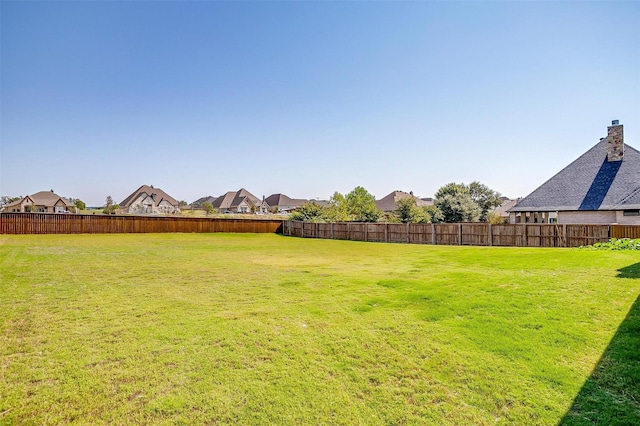 view of yard featuring a fenced backyard