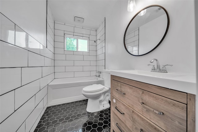 full bathroom featuring tiled shower / bath combo, tile patterned flooring, vanity, and toilet