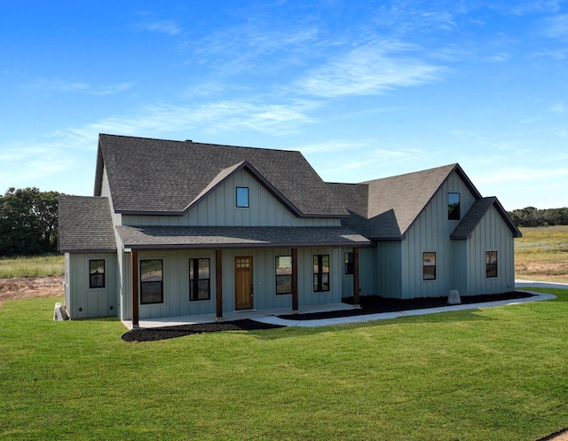 view of front of property with a front yard and a porch