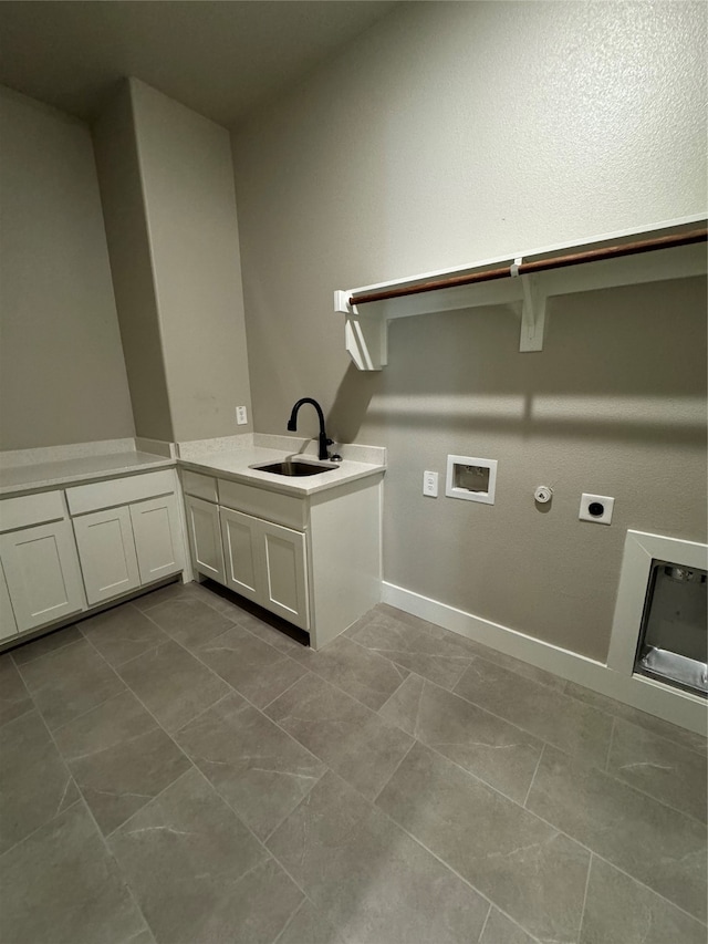 clothes washing area with washer hookup, cabinets, sink, electric dryer hookup, and gas dryer hookup