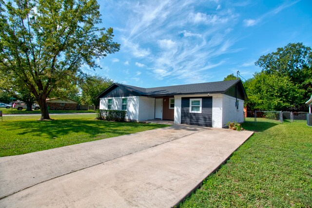 ranch-style house with a front lawn