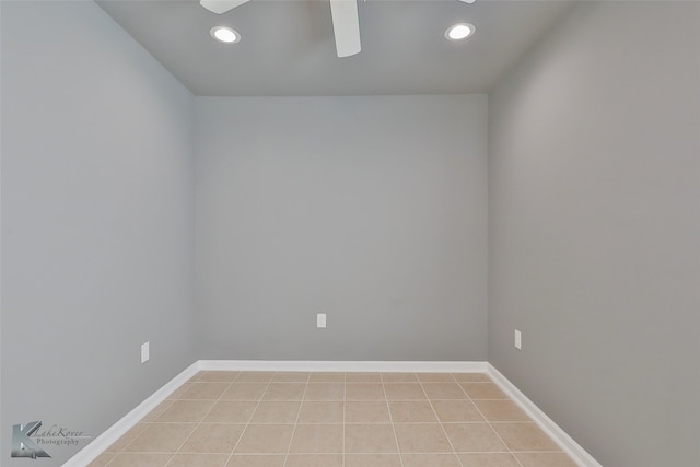 unfurnished room with light tile patterned flooring and ceiling fan