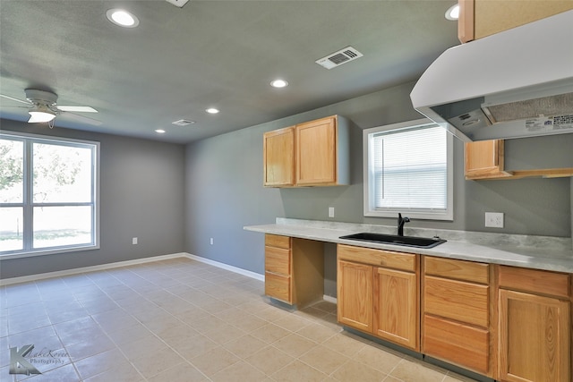 kitchen featuring light tile patterned floors, ceiling fan, extractor fan, and sink